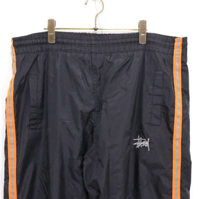 STUSSY 90s-00s | "Red & Blue Tag" Nylon Track Pants "Black / Orange