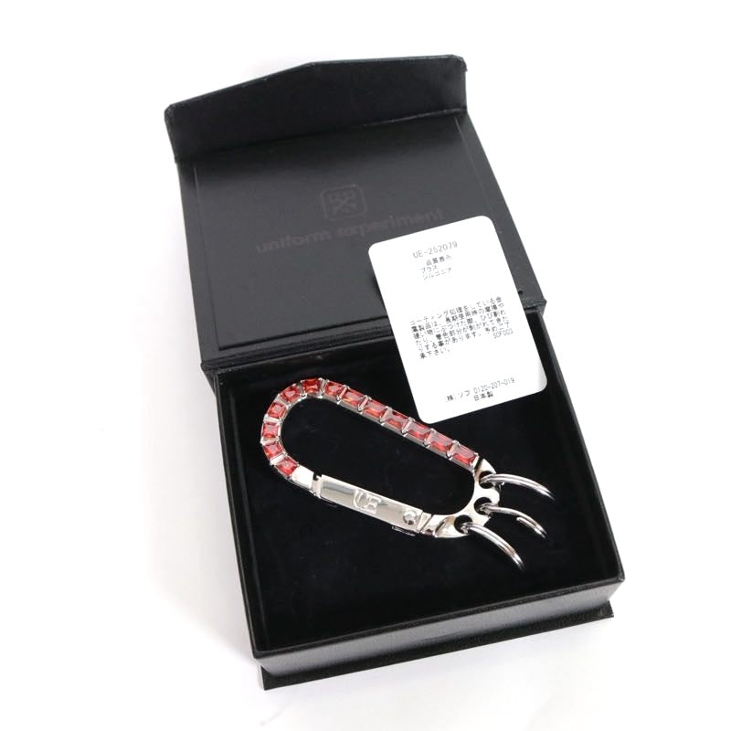 uniform experiment 25AW | ZIRCONIA CARABINER "RED" (UE-252079)