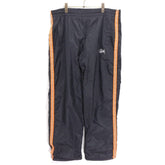 STUSSY 90s-00s | "Red & Blue Tag" Nylon Track Pants "Black / Orange