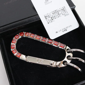 uniform experiment 25AW | ZIRCONIA CARABINER "RED" (UE-252079)