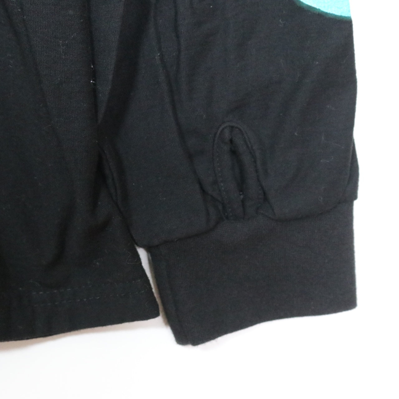 99%IS(ナインティナインパーセントイズ) "SMILEY" Sleeve Logo Long Sleeve T-Shirt
