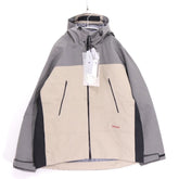 JJJJound × DESCENTE ALLTERRAIN 25AW | HARD SHELL JACKET "Beige / Gray" (DU5FWBJ1MB)